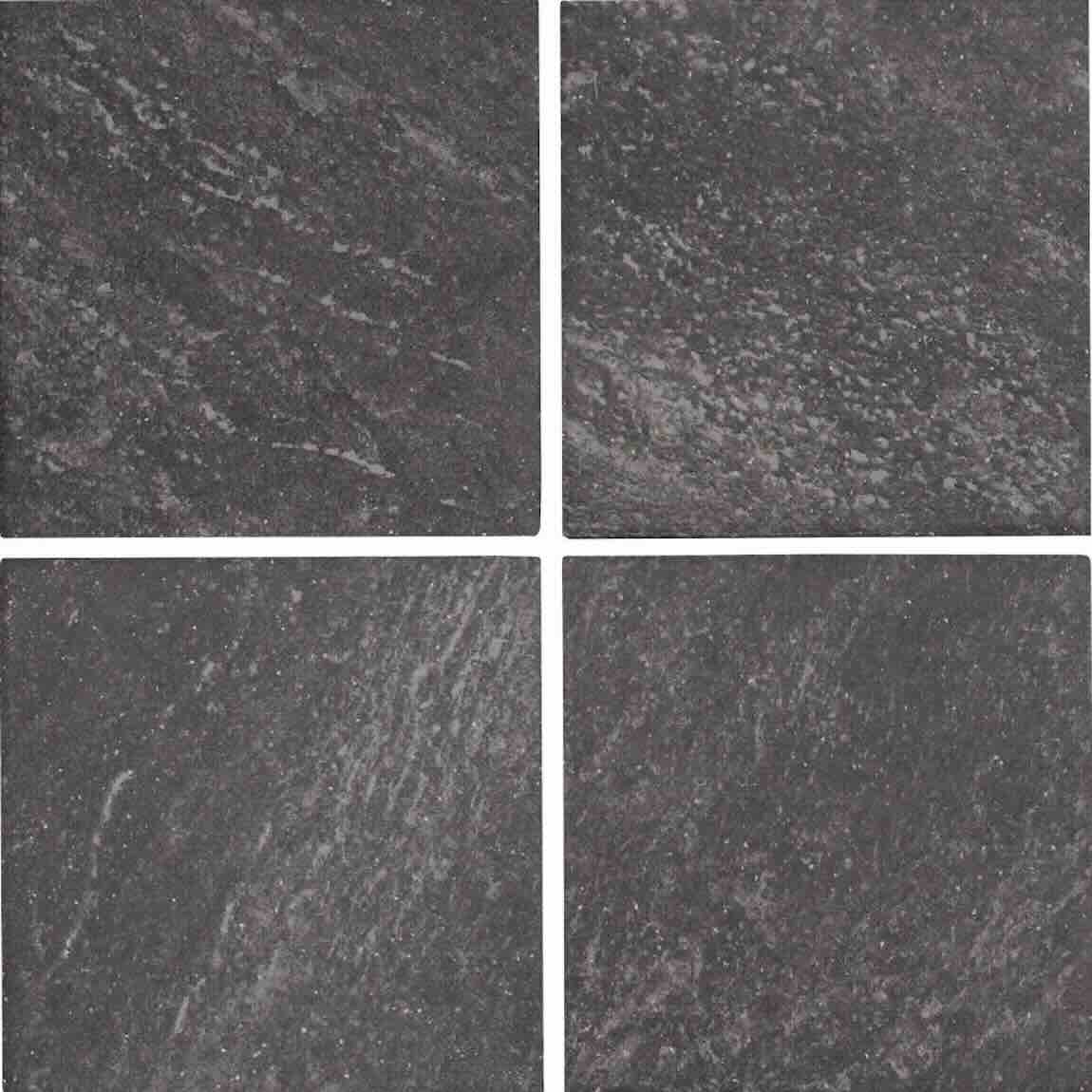 Four square tiles with a dark gray, textured pattern on a white background