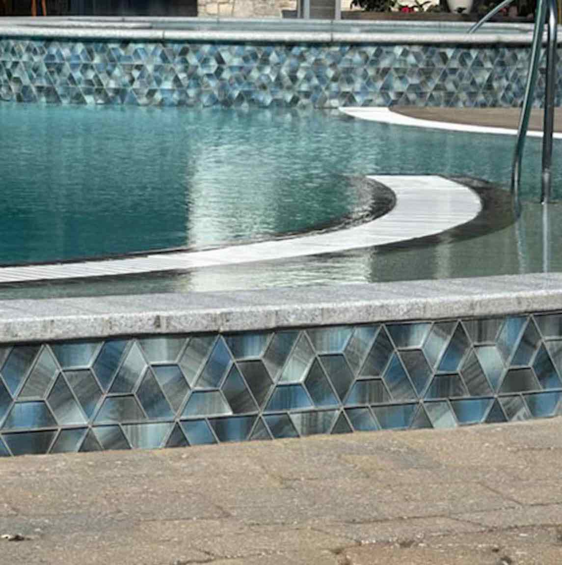 Aspect Morning Blue Geometric Glass Mosaic Tile installed on a pool waterline and spa