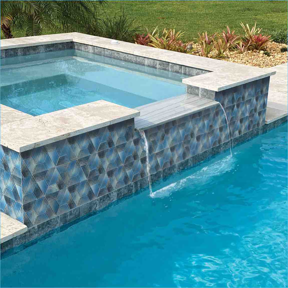 Aspect Morning Blue Geometric Glass Mosaic Tile installed on a pool spa