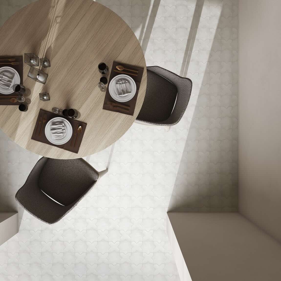 Round wooden table with four chairs in a minimalistic room featuring kasbah patterned tiles