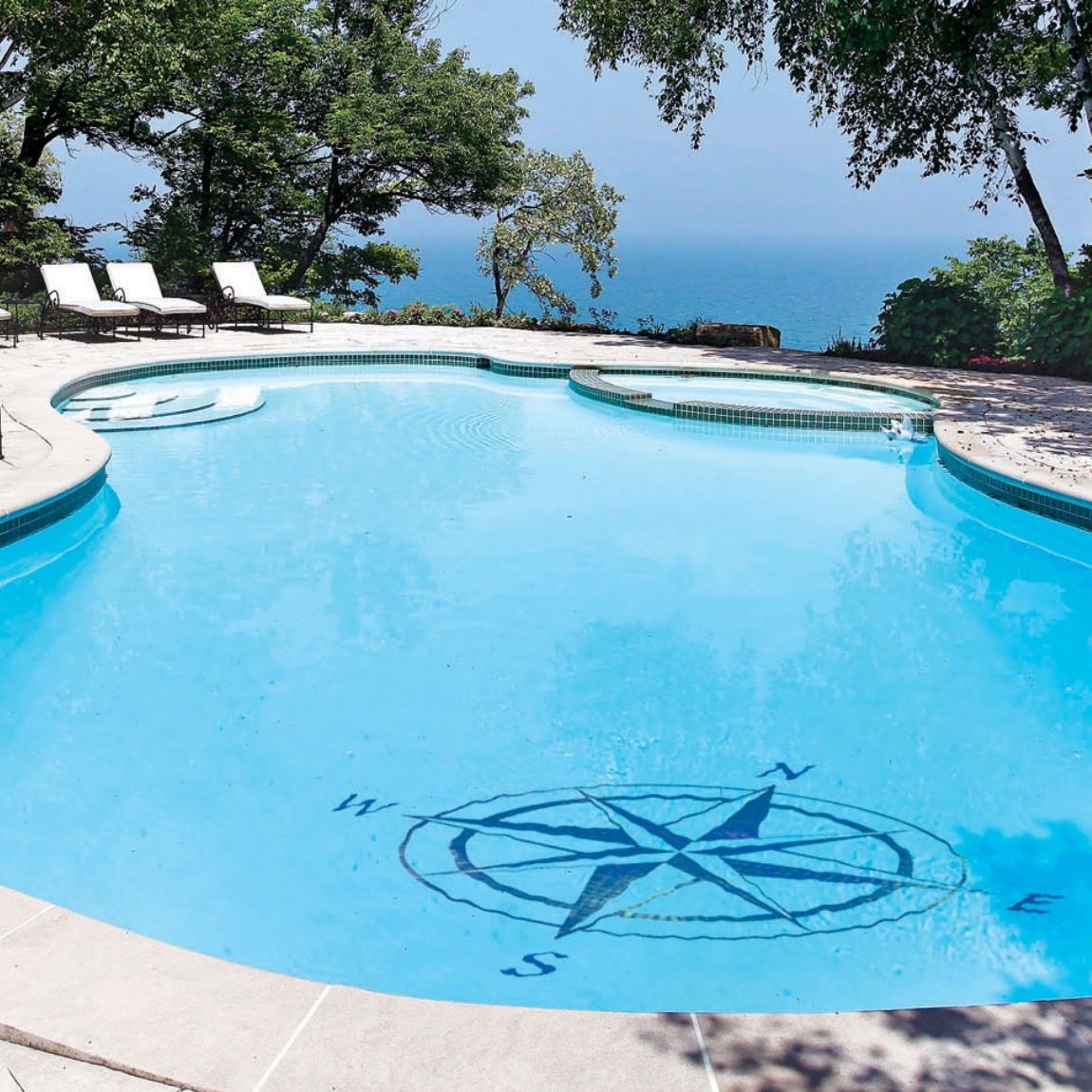 Porcelain Compass Rose Mosaic installed on a swimming pool.