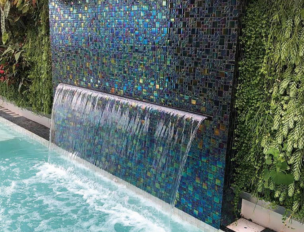 Black Sand glass mosaic tile installed in a swimming pool, featuring a rich dark tone that adds depth and elegance to the water’s appearance