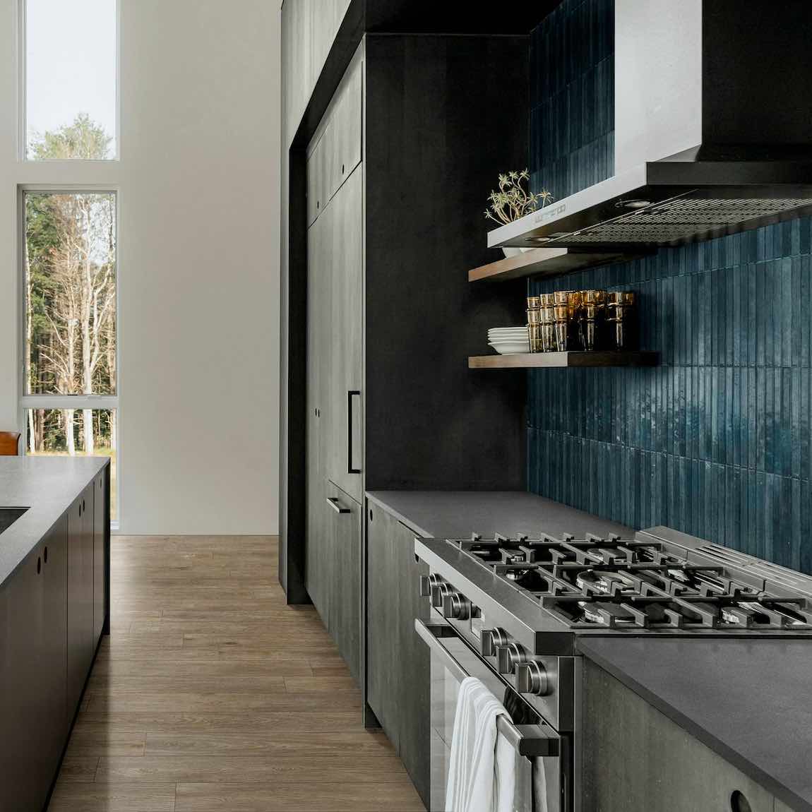 Magnolia 3D Tile Blue 2.5x9.5 porcelain tile featured vertically on a contemporary kitchen backsplash