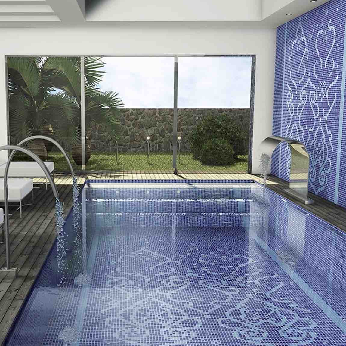 Close-up of blue luminescent recycled glass tile (1x1 inch) installed in a swimming pool, adding a shimmering eco-friendly finish