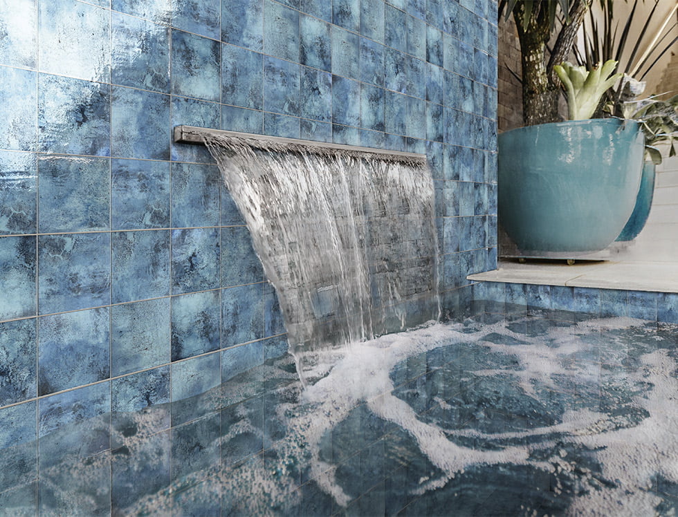 Classic Marino porcelain pool tile installed in a swimming pool, delivering a rich, deep blue tone that enhances the pool’s elegance with a timeless, serene water effect