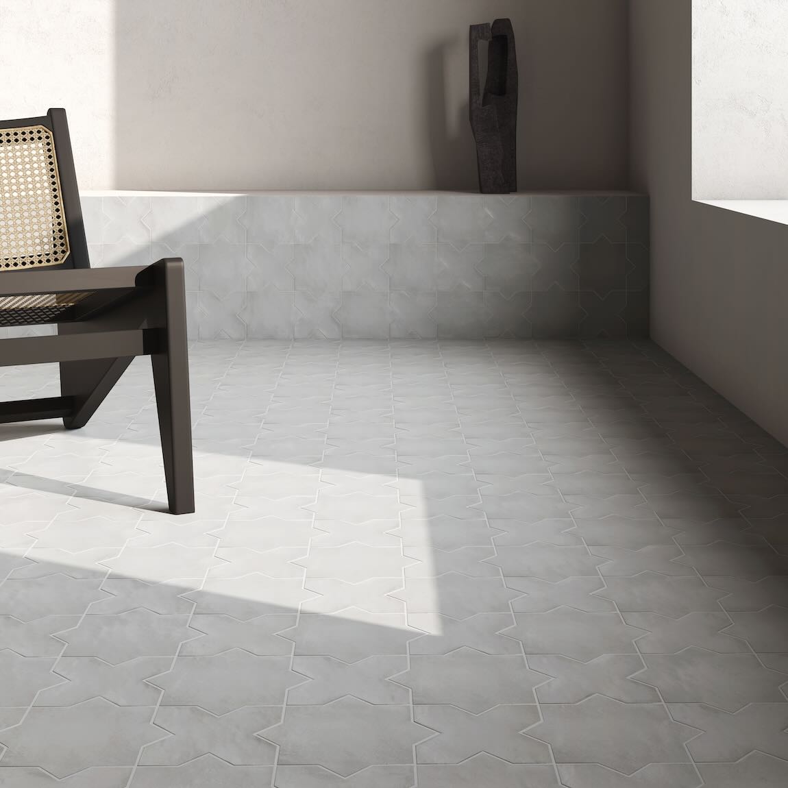 Gray tiled floor with a chair and wall in a room setting
