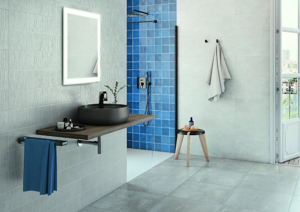 5x5 glazed ceramic tile in coastal blue shade installed on a shower wall, creating a calm, ocean-inspired look with a glossy, water-resistant surface perfect for spa-like bathrooms