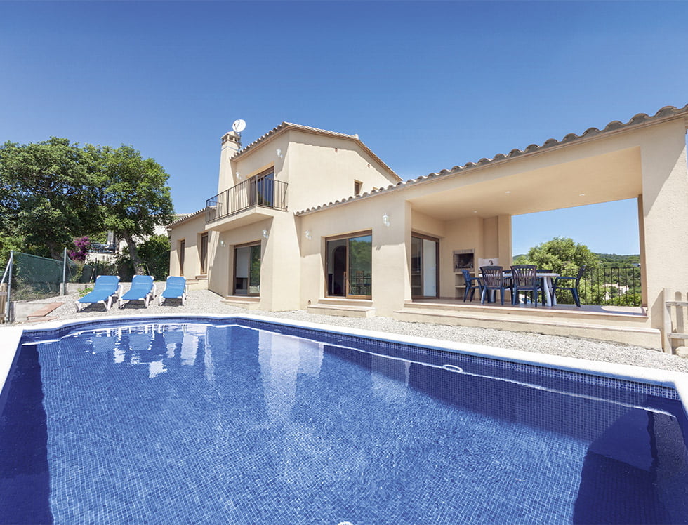 Dark blue recycled glass tile installed in a swimming pool, offering a deep, oceanic look while reflecting light with an eco-conscious design