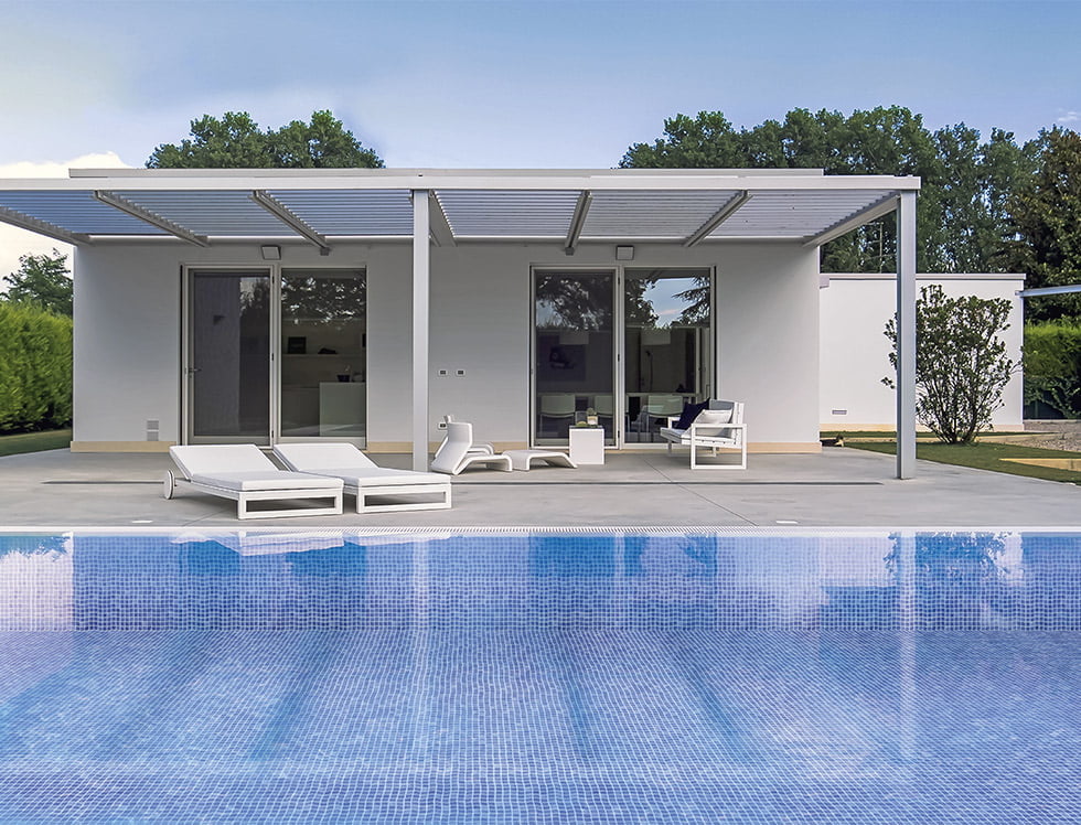 Light blue recycled glass tile installed in a swimming pool, offering a calming and eco-conscious look with soft, reflective water tones