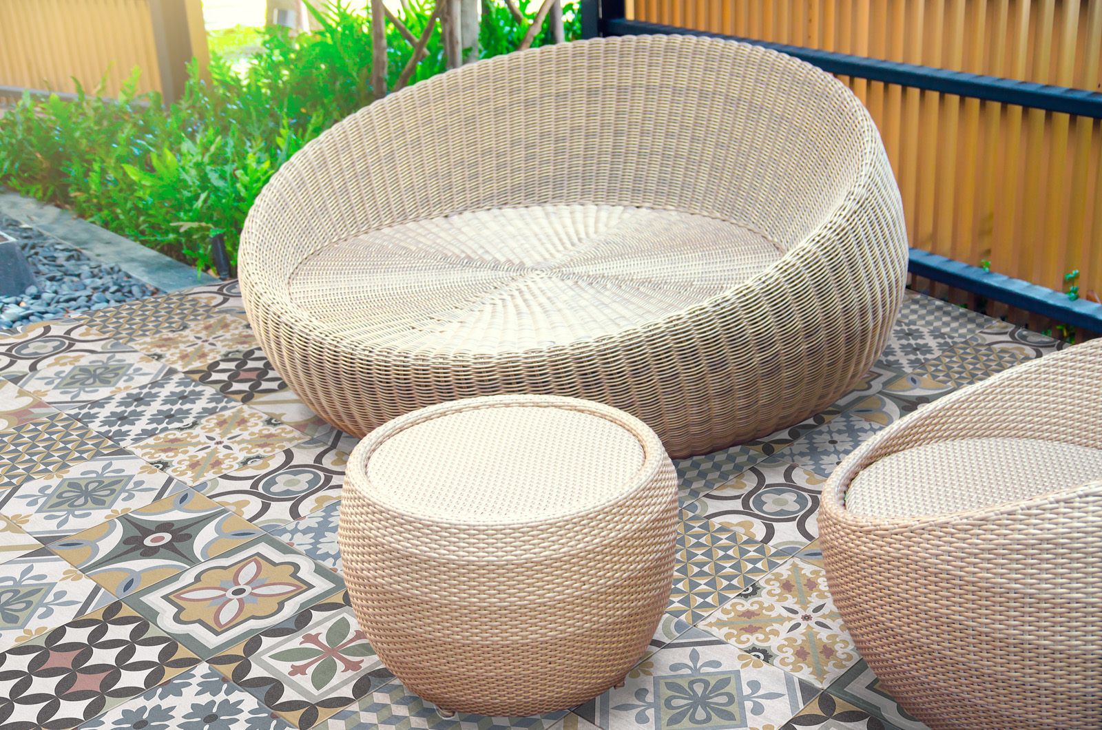 Colorful geometric patterned porcelain tile installed on a patio floor, creating a lively, artistic, and weather-resistant surface perfect for outdoor gatherings