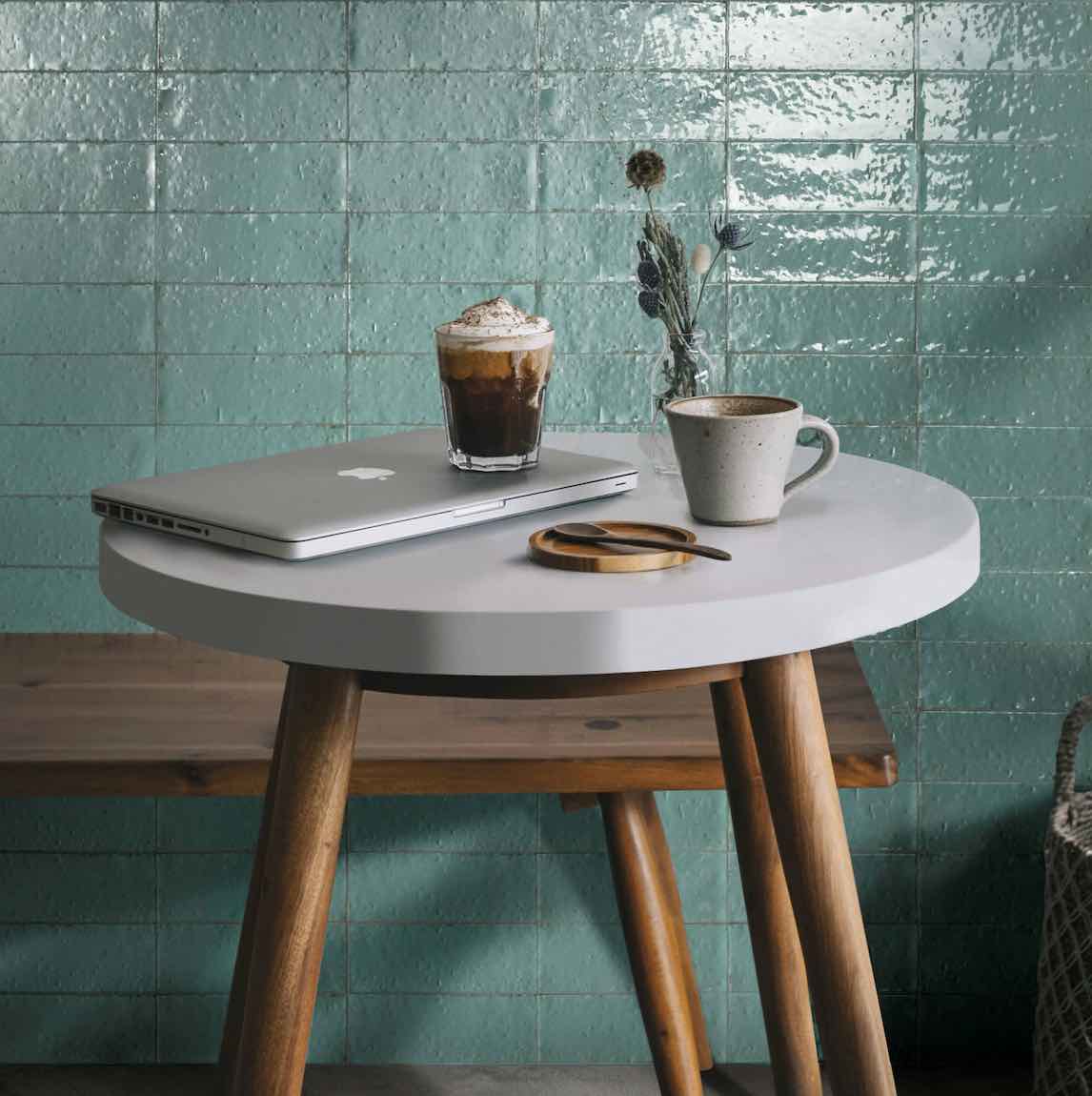 Glacier turquoise 3x8 subway tiles installed on a wall, featuring a sleek and refreshing look with cool blue tones