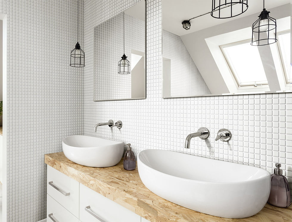 Recycled glass tile in solid white installed on a bathroom wall, offering a clean and minimalist aesthetic with a sleek, eco-friendly finish