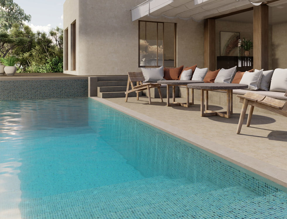 Preserve series recycled glass mosaic tile in the Kea colorway, installed in a pool to create a vibrant, eco-friendly, and coastal-inspired water effect