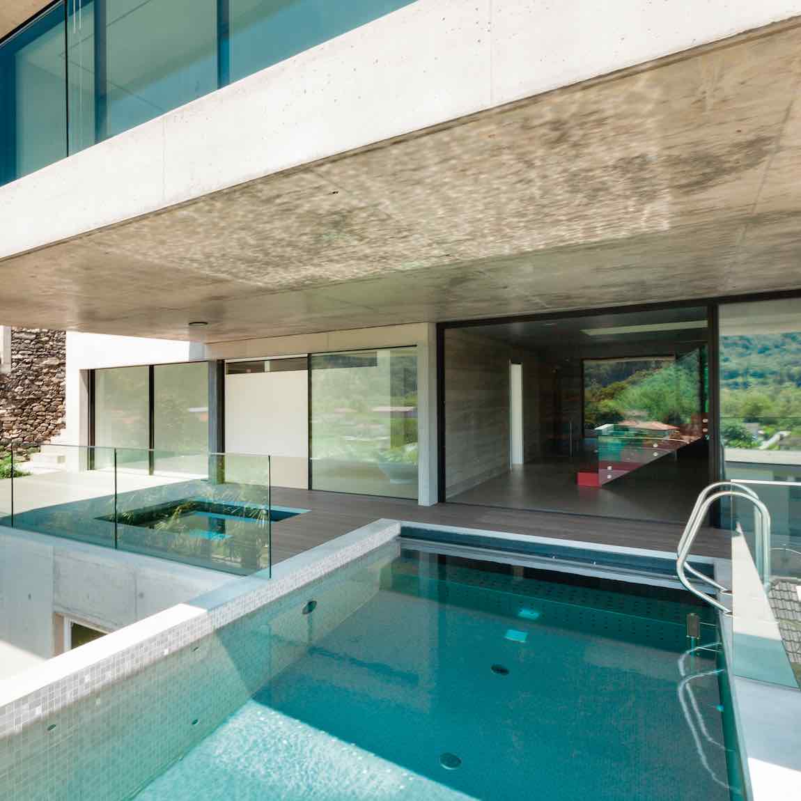 Modern house with a pool and glass walls