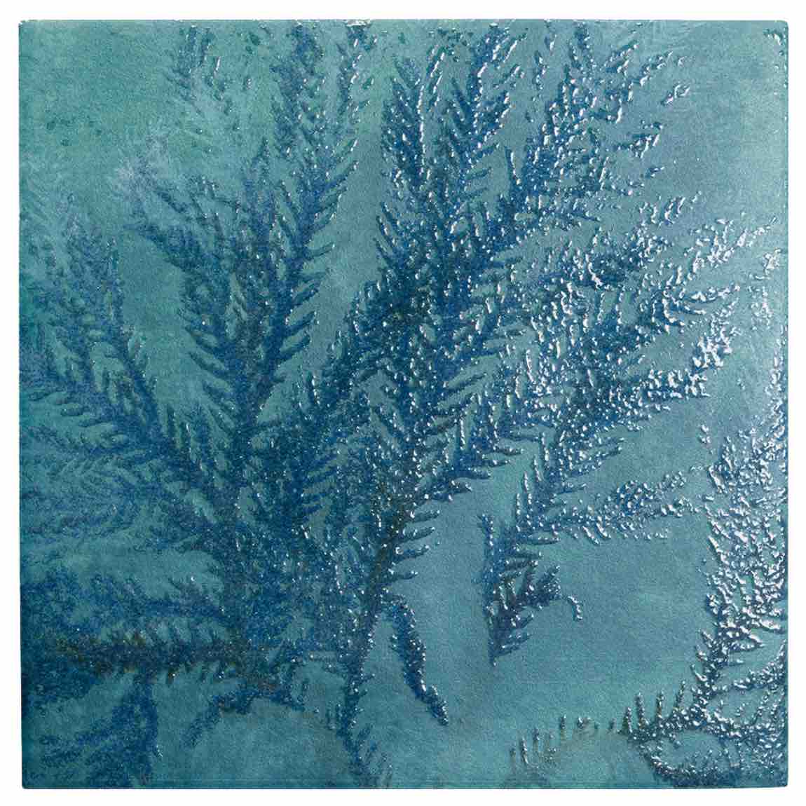 Textured blue ceramic tile with leaf pattern