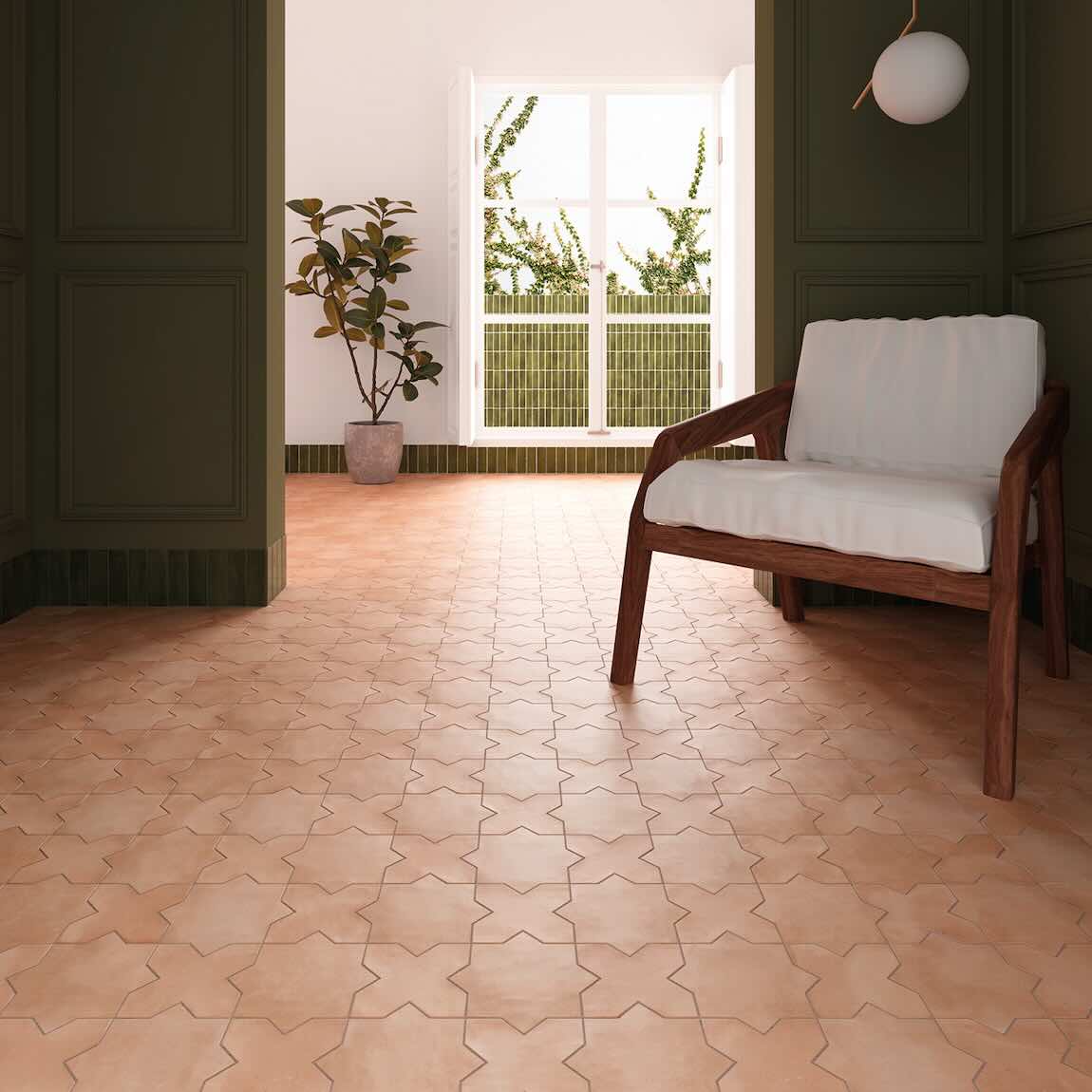 Wooden chair with white cushion on a patterned terracotta Parma Kasbah floor tiles in a room with a large window.