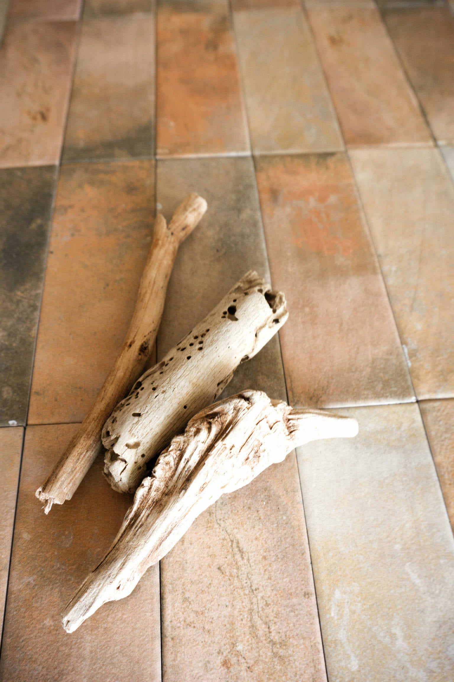 Tavern porcelain tile in medium terracotta, sized 2x6, installed on the floor to deliver a warm, rustic ambiance with natural clay tones and durable, textured porcelain finish.
