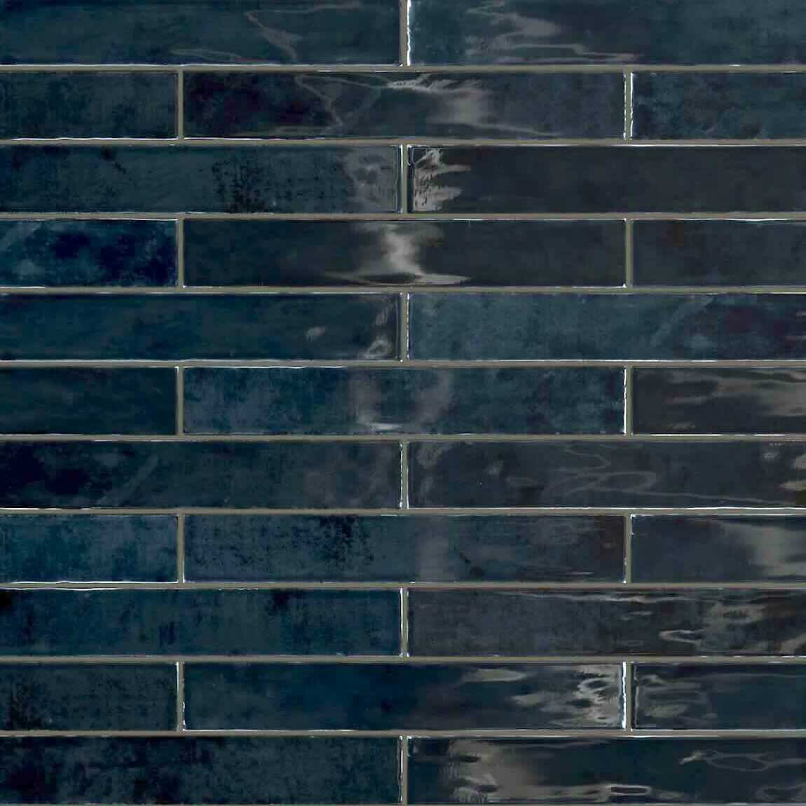 Persia Blue Subway Tile features a glossy finish and a Zellige-inspired design, ideal for wall applications in the kitchen, bathroom, fireplace, & more
