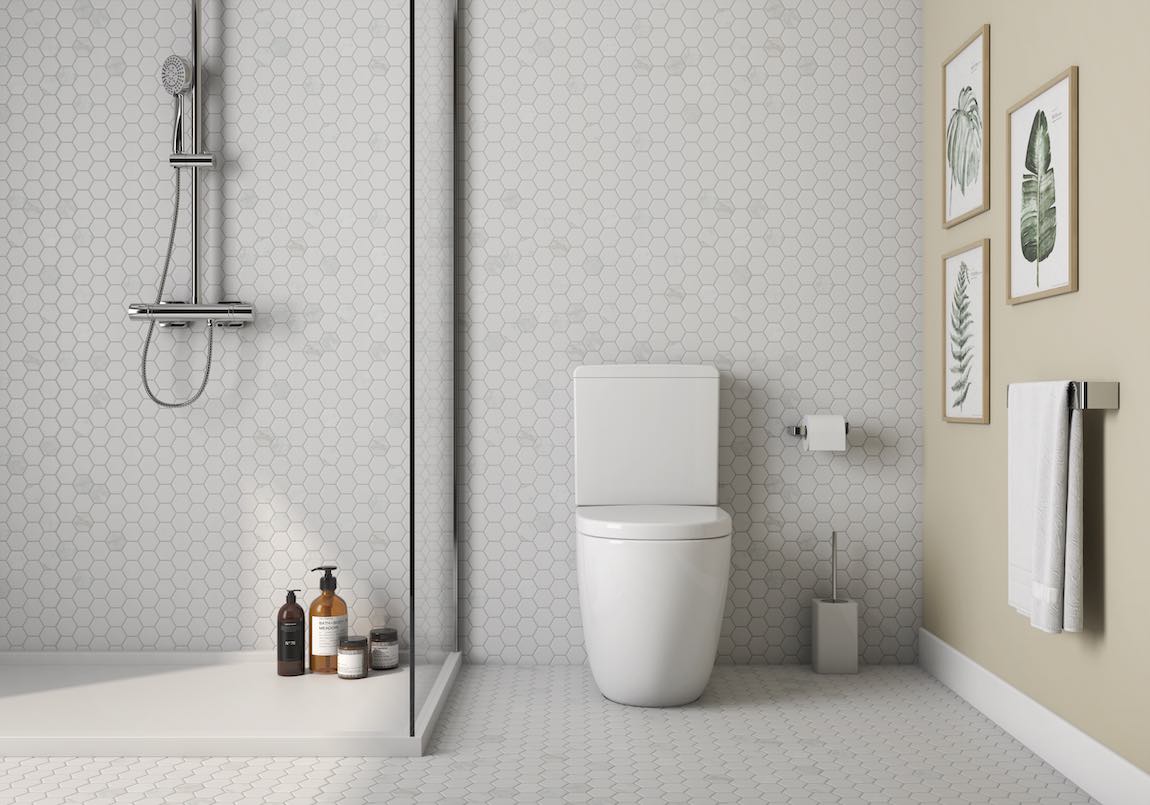 Hexagon Carrara White Marble Mosaic Tile 2x2 featured on a bathroom floor and wall