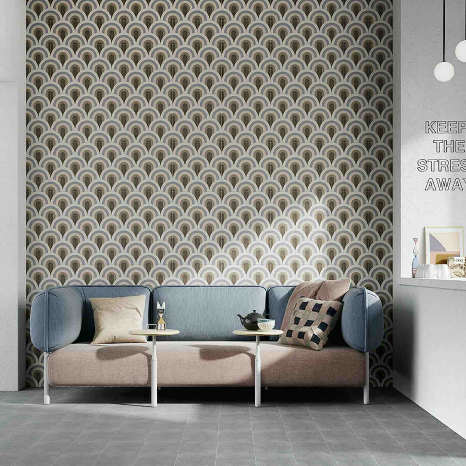 Patterned porcelain tile with a cement-look finish, installed on a living room wall to create an urban, textured, and contemporary feature accent