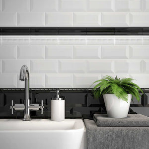 Bathroom Backsplash featuring a mis of white and black subway tiles 3x6 beveled and glossy finish