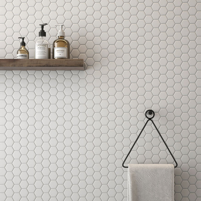 white hexagon tiles featured on a bathroom wall