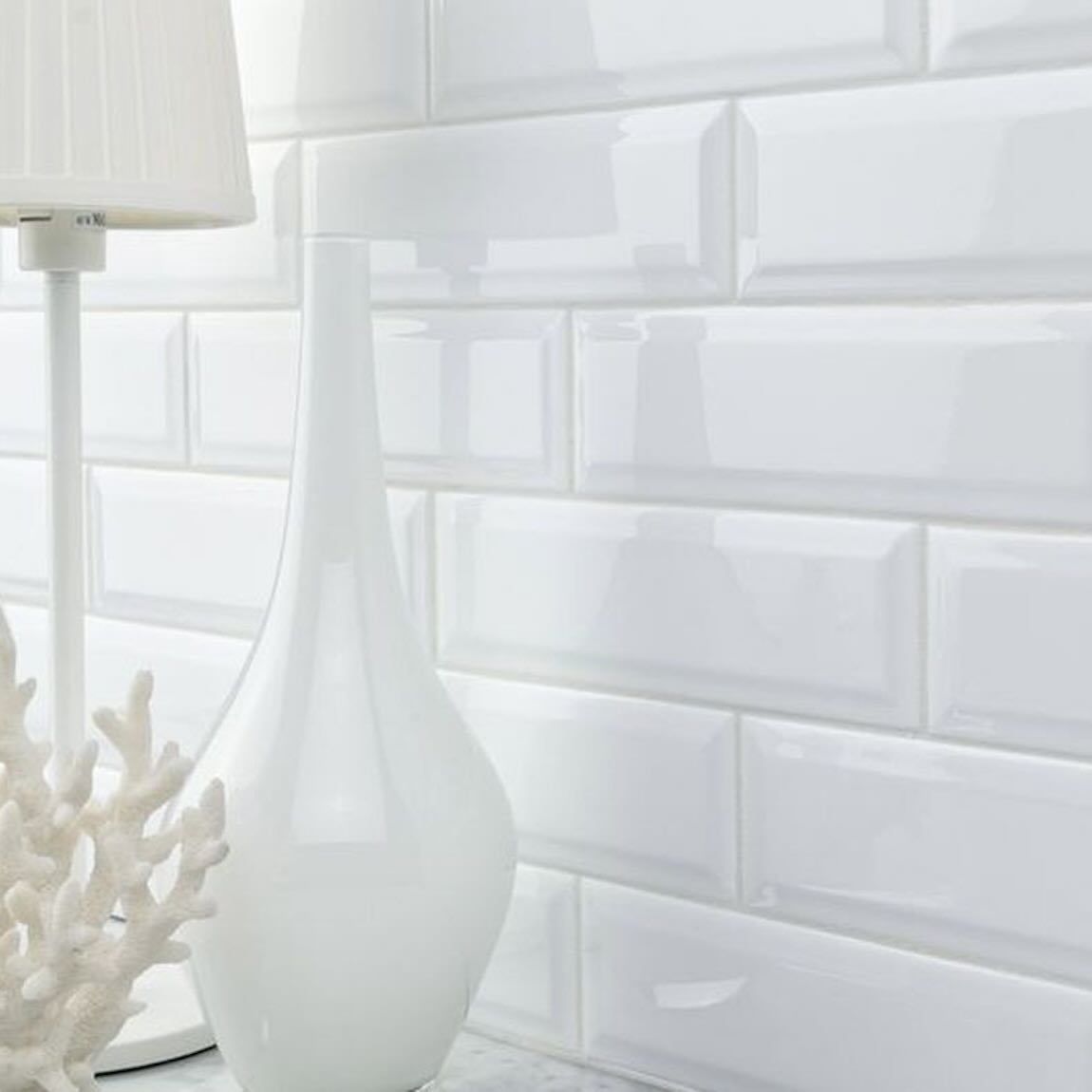 Subway Ceramic Tile White Glossy Beveled 3x9 Backsplash with a white vase