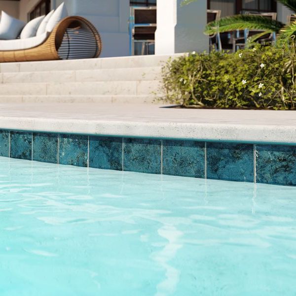 Turquoise Waves Porcelain Pool Tile 6x6 featured on a pool waterline