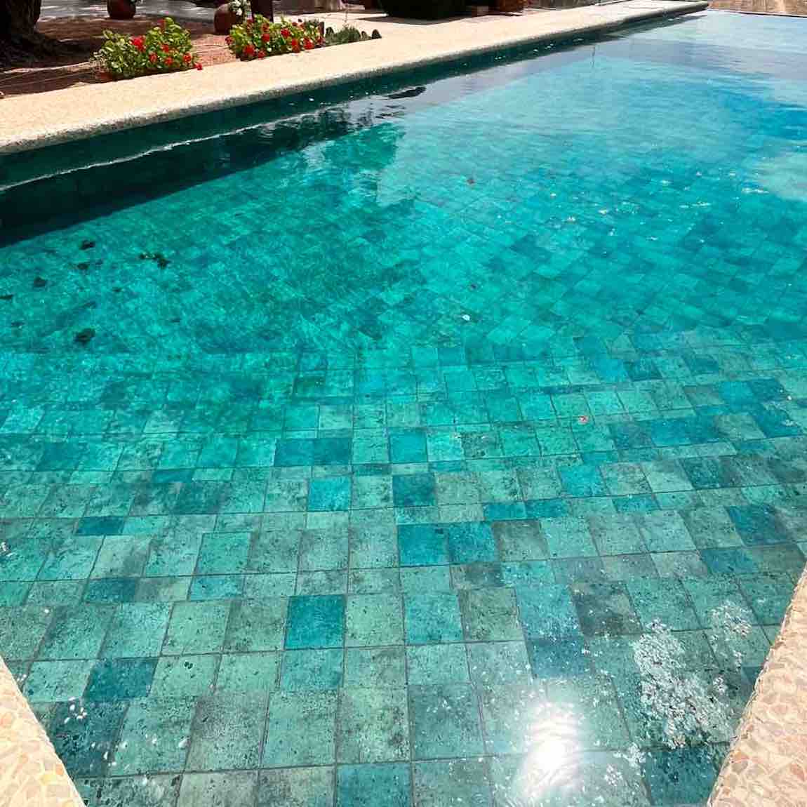 Papeete Emerald Pool Tile 6x6 Bright featured on a infinity pool