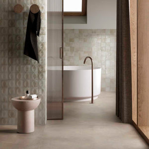 Storie Distressed Tile Glossy Beige 4x4 featured on a bathroom wall