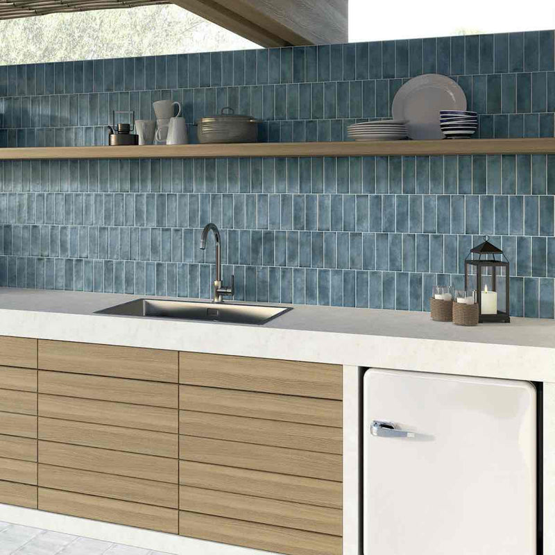 Organic Style Subway Tile Blue 2x6 featured on an outdoor kitchen backsplash