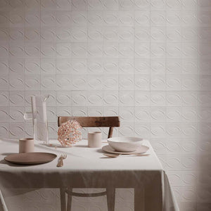 Storie Distressed Tile White 4x4 Deco Egg featured on a dining room accent wall