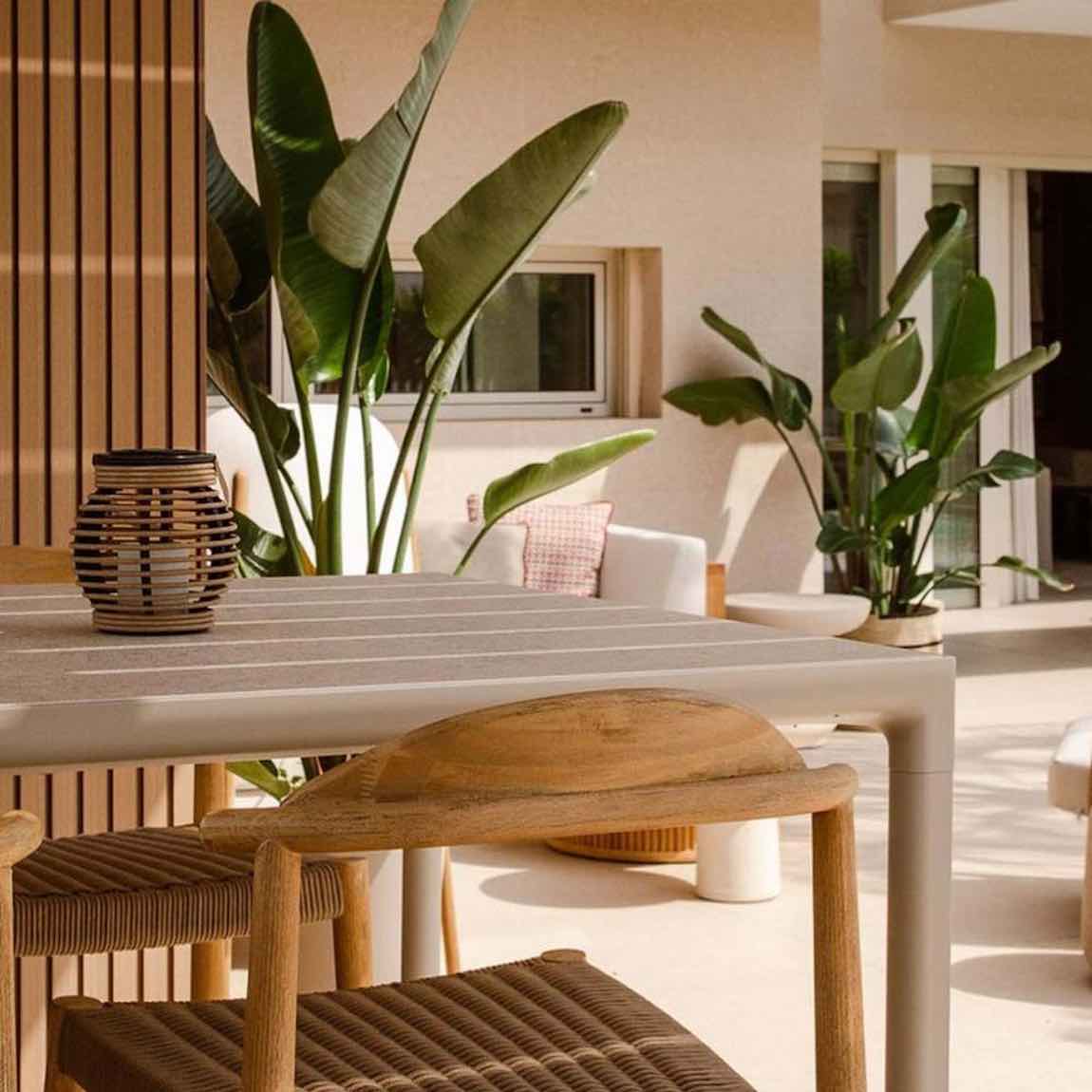The Eco Slatted Decorative Wall Panel Flow Oak 8x96 featured on a dining room wall