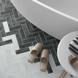 Organic Style Subway Tile Grey 2x6 mixed with the Graphite featured on a bathroom floor
