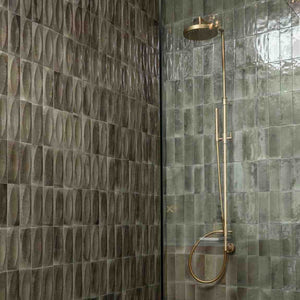Storie Distressed Tile Gray 3x8 Deco Eye featured on a shower wall