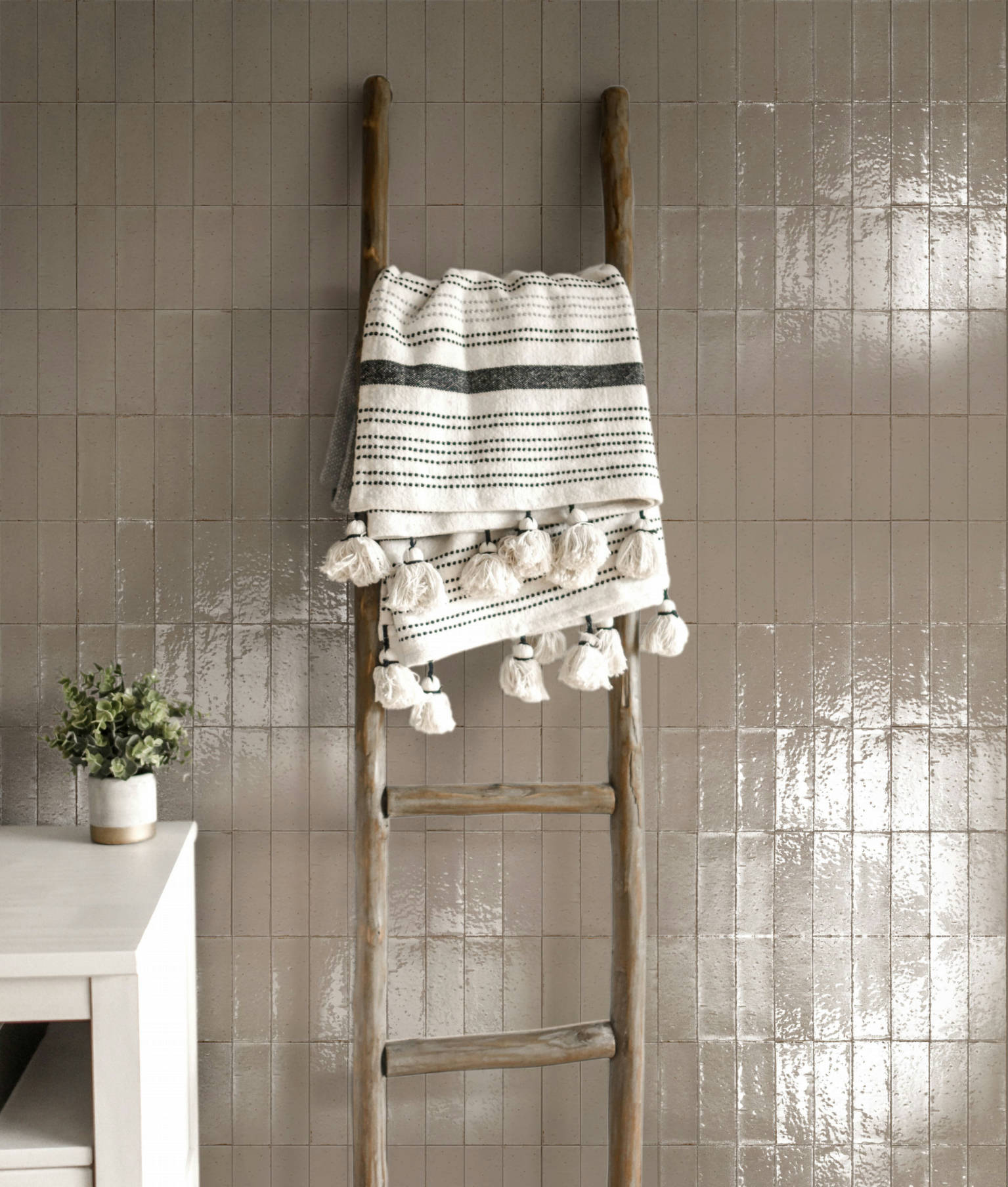 Soft-toned Mastice subway tiles installed on a bathroom wall, adding a serene and elegant atmosphere with a glacier-inspired look
