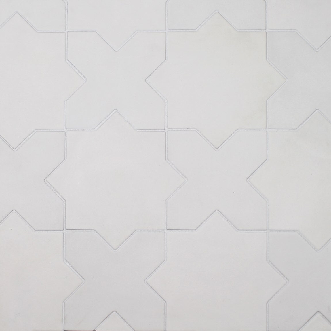 White kasbah parma tiles arranged in a pattern on a white background