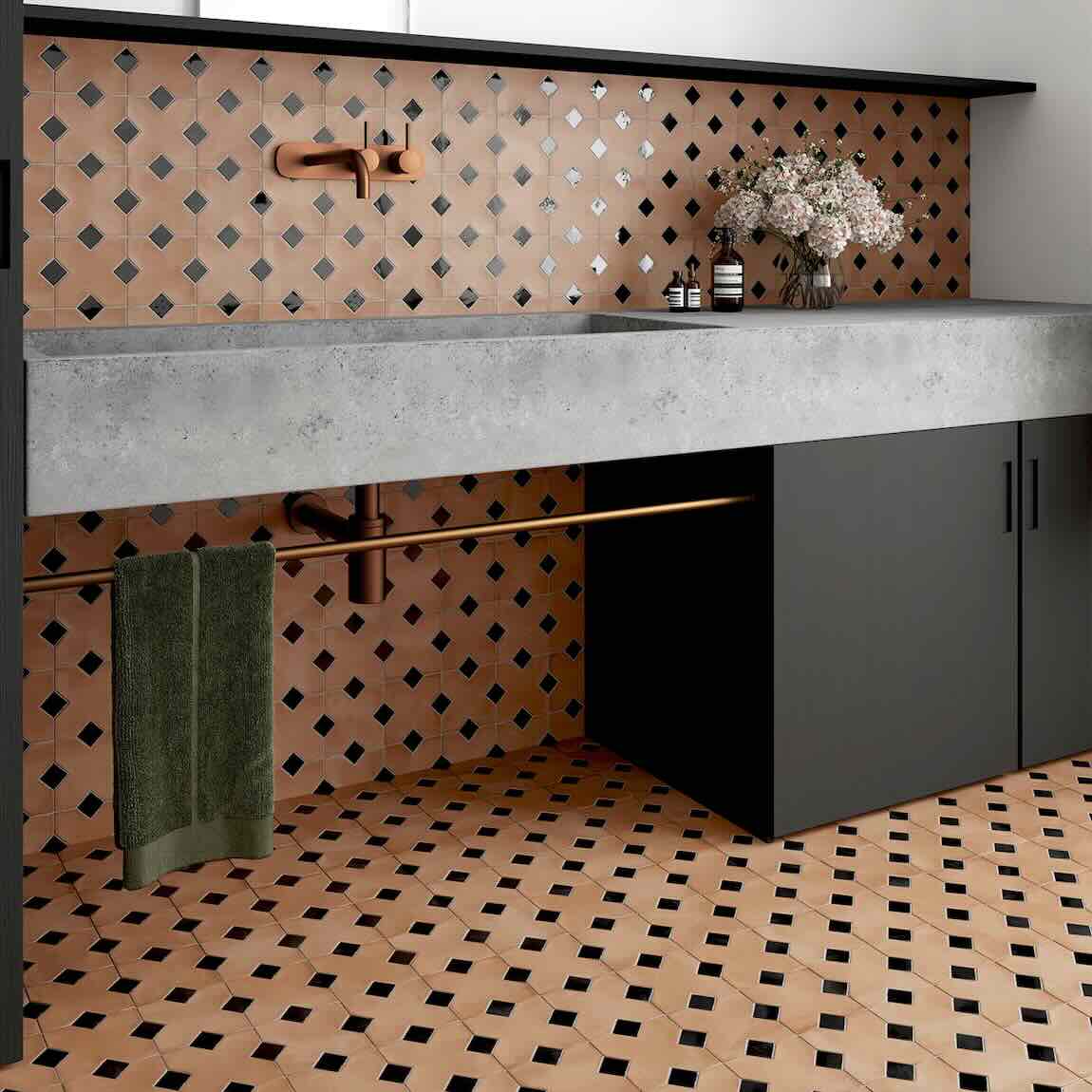 Modern kitchen with concrete countertop, black cabinets, and patterned backsplash and floor featuring kasbah terracotta tiles with black accent
