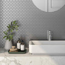 Stainless Steel Subway Tile Silver 1x2 installed on bathroom vanity backsplash