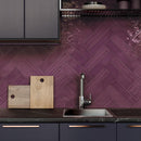 Kitchen backsplash featuring the Slide Plum Glossy 3x12 Subway Wall Tile by Mineral Tiles