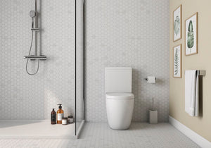 Hexagon Carrara White Marble Mosaic Tile 2x2 featured on a bathroom floor and wall