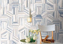 Studio Hexagon Swirl Blue Porcelain Tile 9x10 installed on a featured wall