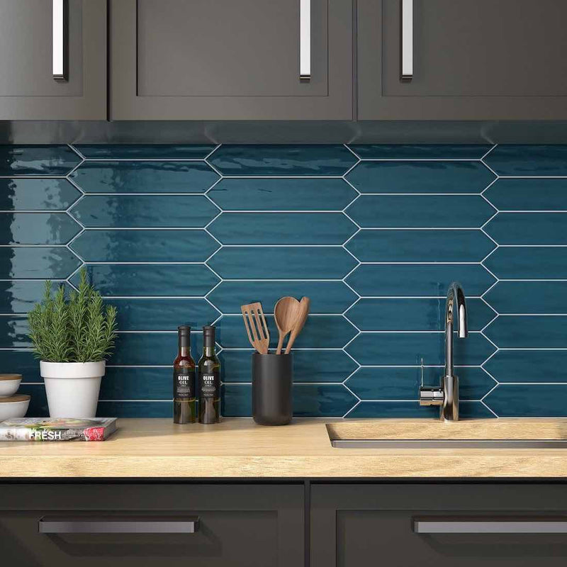 Backsplash Picket Wall Tile in Peacock Teal Color installed horizontally with grey cabinets and wood countertop