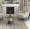 Fireplace in a classic setting with neutral color chairs and wood look patterned porcelain tiles on the floor by Mineral Tiles