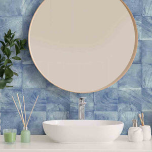 Atol Porcelain Tile Azure 6x6 installed on a bathroom backsplash behind the vanity