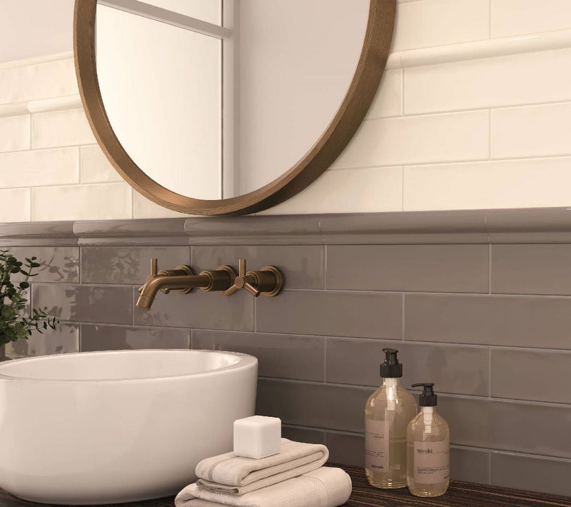 Subway Wall Tile Glossy Ivory 3x12 featured on a bathroom backsplash with copper hardware