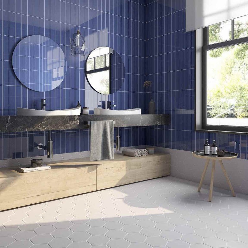 Minimalistic Subway Tile 2x10 Blue Glossy featured on a bathroom blue wall and grey hexagon floor