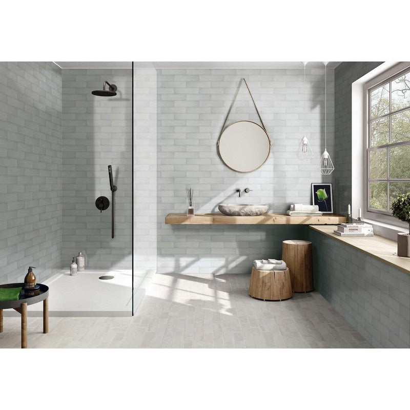 Contemporary grey bathroom and shower with subway tile and wood accents