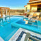swimming pool and spa featuring a aqua iridescent glass mosaic tile by Mineral Tiles