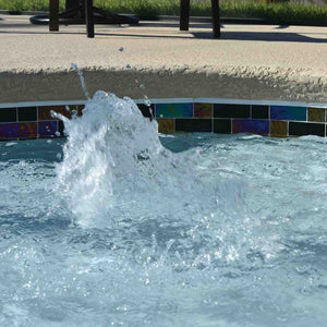 Swimming Pool waterline featuring a black iridescent glass tile by Mineral Tiles